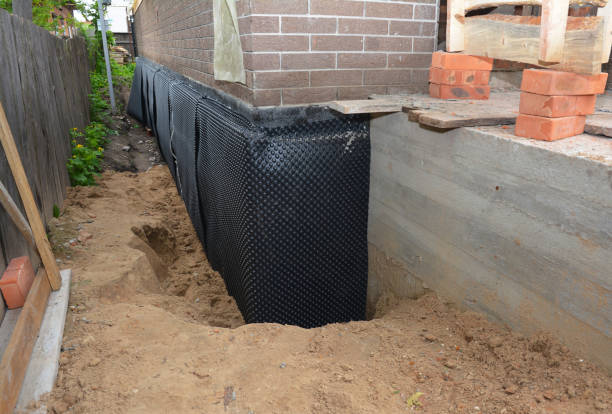 Happy homeowners after waterproofing job in Union Grove